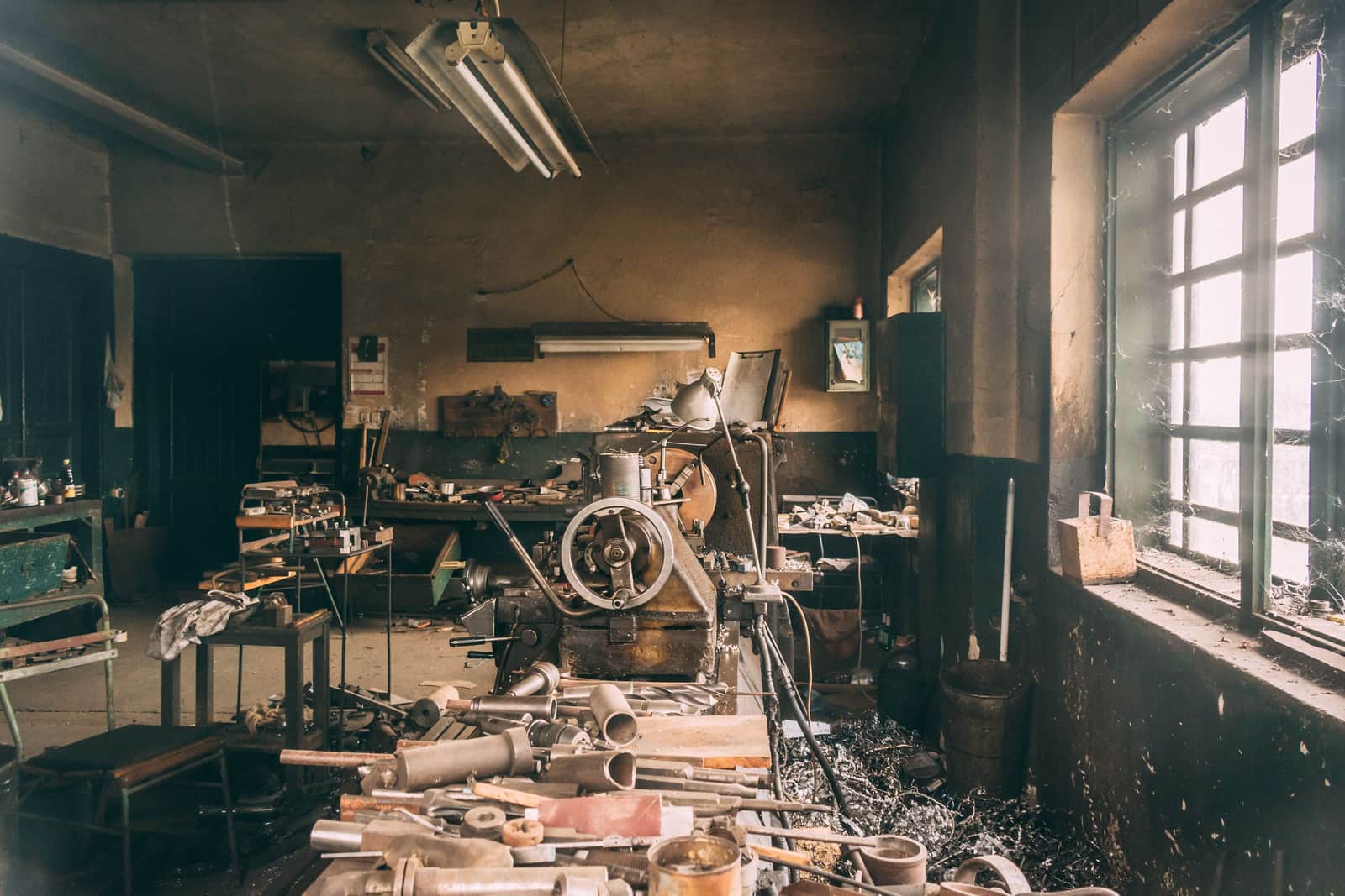 Metal pipe and hand tools laid out on a workbench