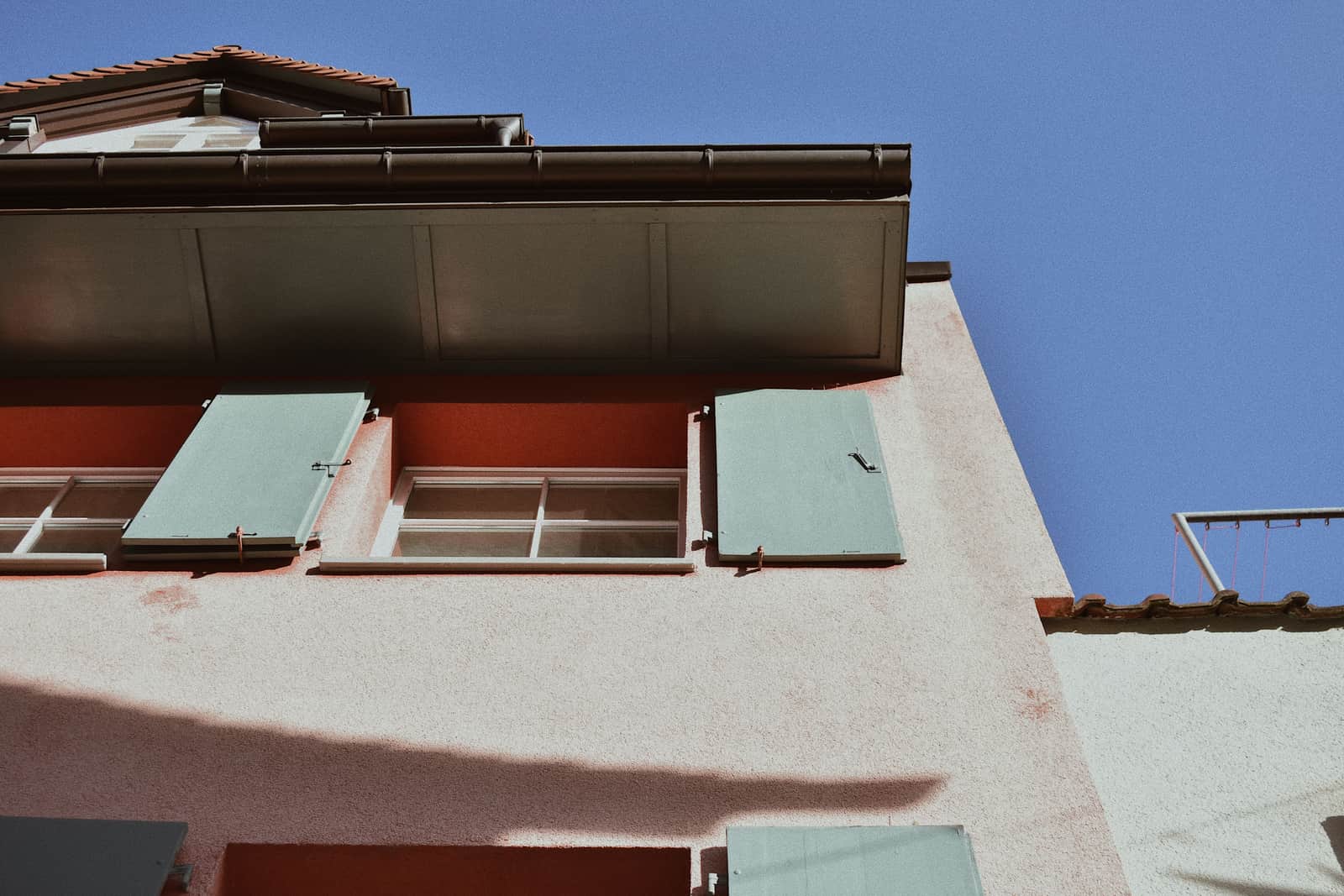 The roof eaves and gutter line of a house exterior